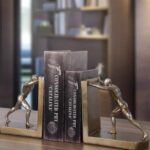 Golden Man Pushing Bookends