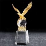 Heavy metallic Eagle with a crystal glass base